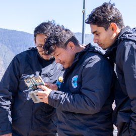 Bhutan team operating a drone