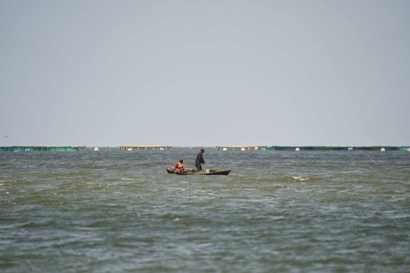 A shot of a fishing cage on Lake Victoria at a distance.