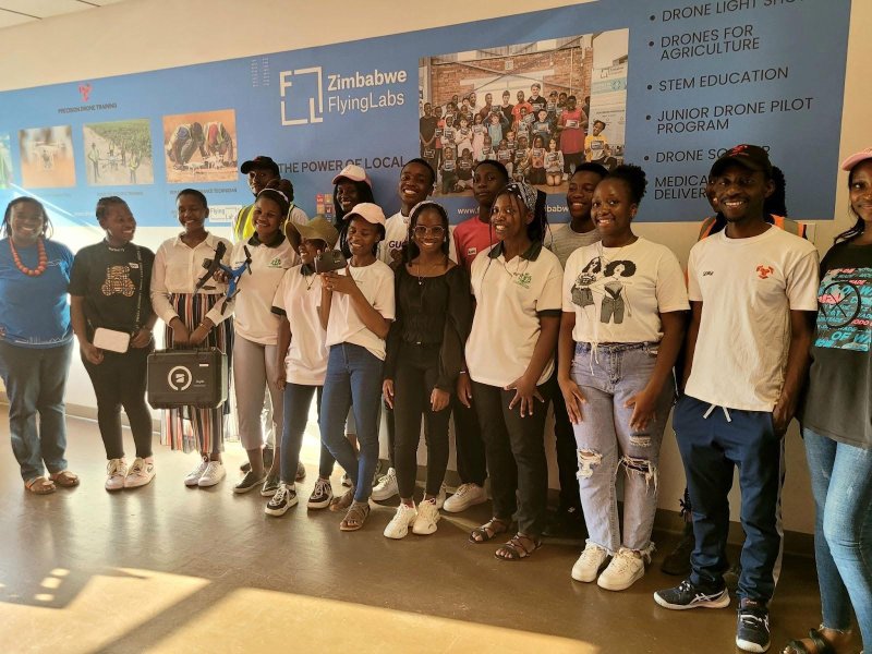 The participants take a group photo with Zimbabwe Flying Labs.