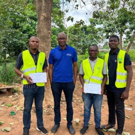 Team members of Nigeria Flying Labs wearing reflector vests on a drone flight mission during their Turning Data Into Action project.