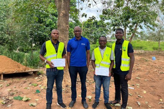 Team members of Nigeria Flying Labs wearing reflector vests on a drone flight mission during their Turning Data Into Action project.