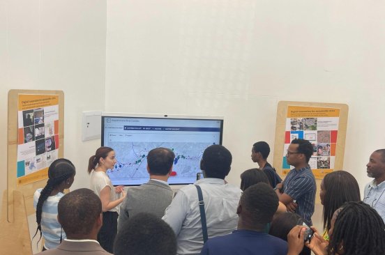 A small group of attendees pays attention to a presentation being made at the Urban Technology & Collaboration in Informal Settlements symposium in Namibia.