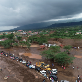 A drone shot showing a road in Mai Mahiu filled with human and vehicle traffic following the flooding disaster in April 2024.