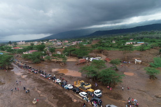 A drone shot showing a road in Mai Mahiu filled with human and vehicle traffic following the flooding disaster in April 2024.