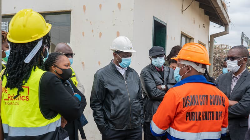 Zambia Flying Labs and partners reviewing the site for a waste management project