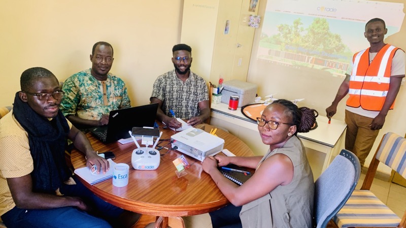 Burkina Faso Flying Labs team sitting around a table