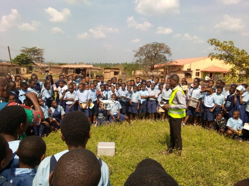 The students of Iwase Grammar School, Ilado practicing drone flights on an open field